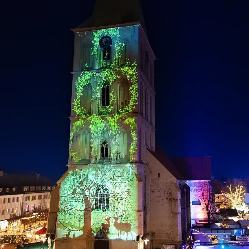 3D light show projection of a forest with deer on a church in Hamm