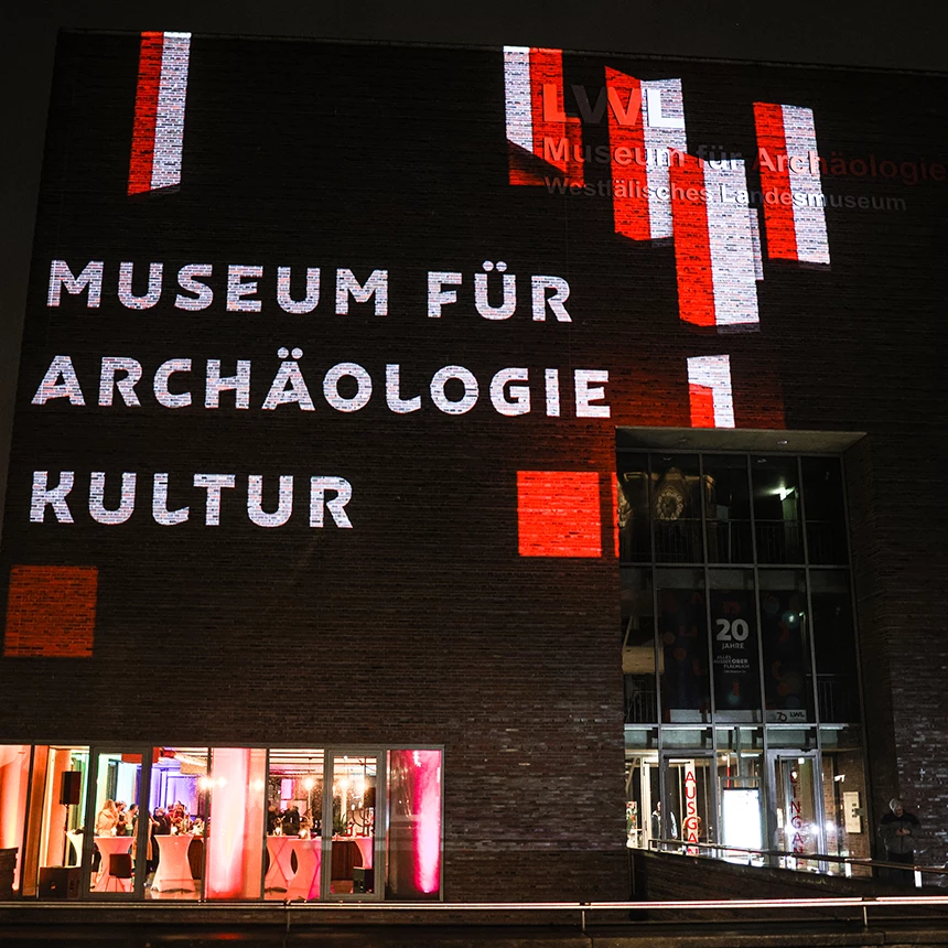 The lettering Museum for Archeology and Culture projected onto the LWL Museum building in Herne