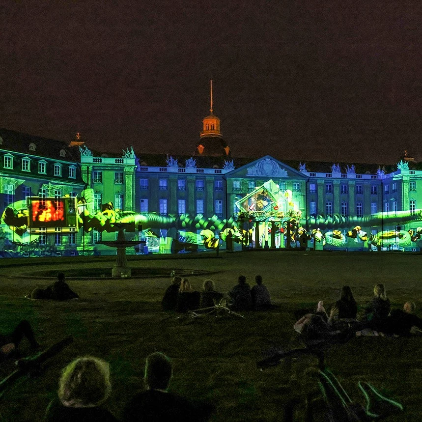 Projection mapping on the palace facade in Karlsruhe on the topic of Green Deal shows garbage monsters under water