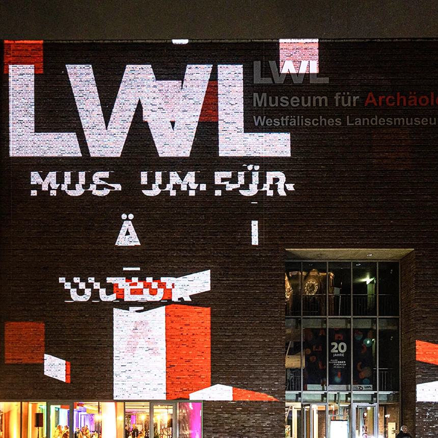 Logo projection of the LWL logo onto the LWL Museum for Archeology and Culture in Herne