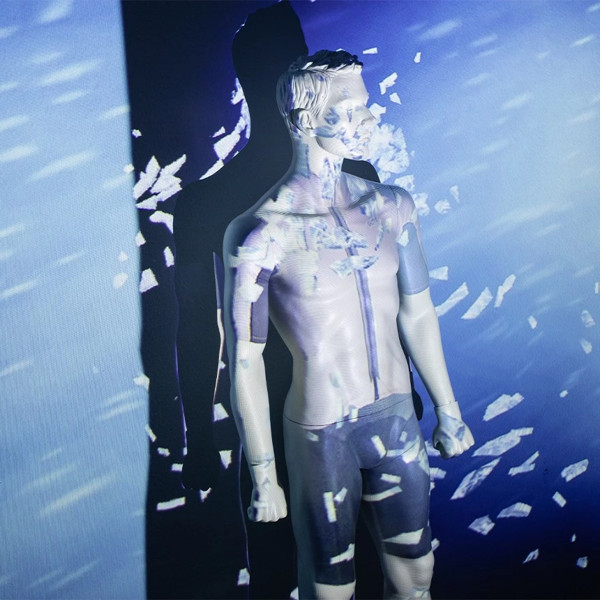 Projection mapping on a mannequin showing various weather conditions during the product presentation of the Gore Bike Wear line at the Eurobike trade fair