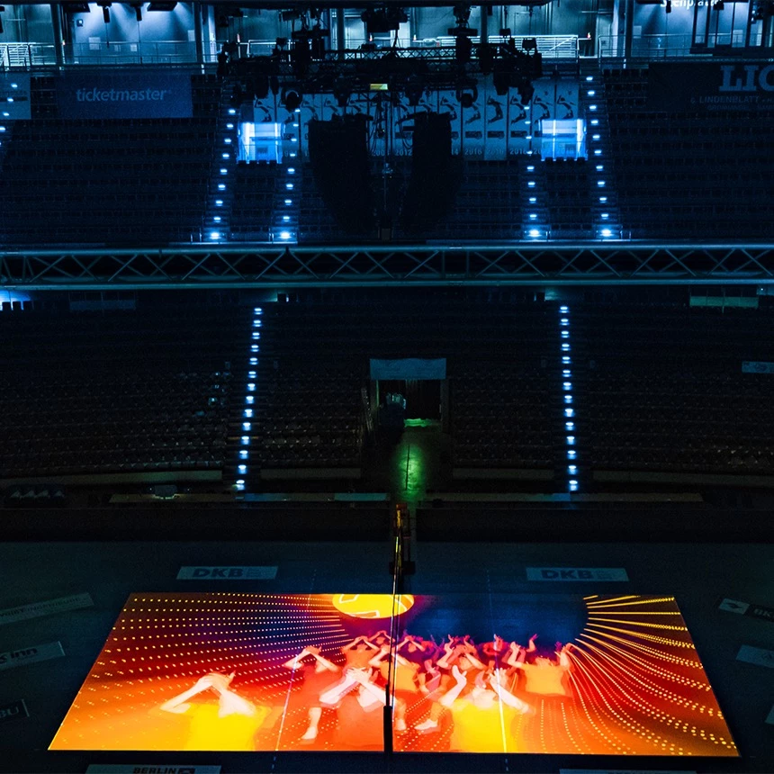 Floor projection with volleyball players on the playing field in a multi-purpose hall