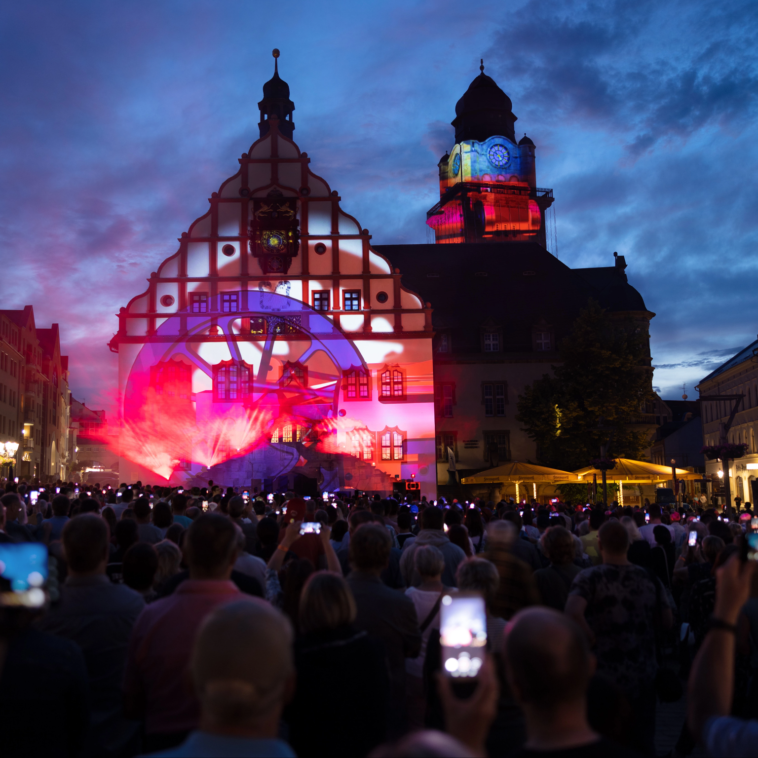 Beamer show on the facade of the town hall in Plauen shows the town's history on the town hall and its tower