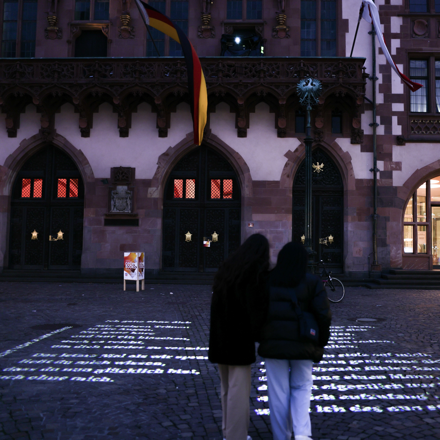 Video projection of texts on the floor of the Römerberg in downtown Frankfurt for the cultural project "Today I write poems, today I write history"