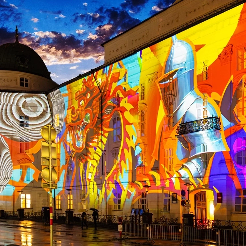 The facade of the Hofburg in Innsbruck is decorated with a knight and a dragon in a light art installation