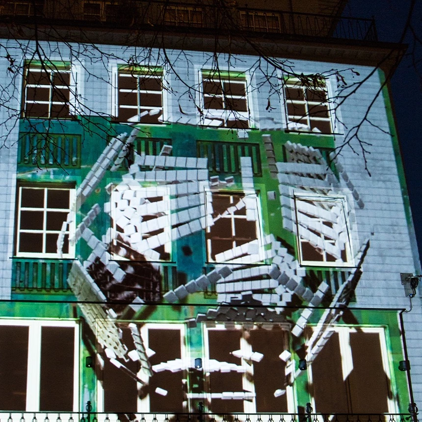 3D video mapping with green and white pixel effects on the Brooks store in Bielefeld