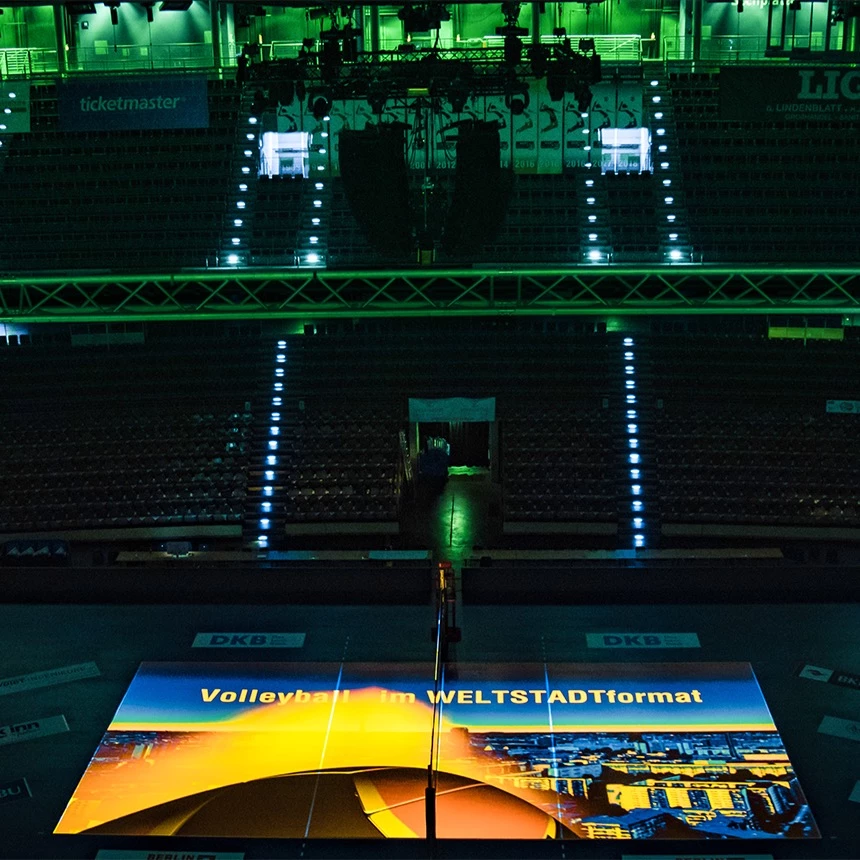 Video projection on the hall floor of the Max-Schmeling-Halle with the lettering volleyball in a cosmopolitan city format