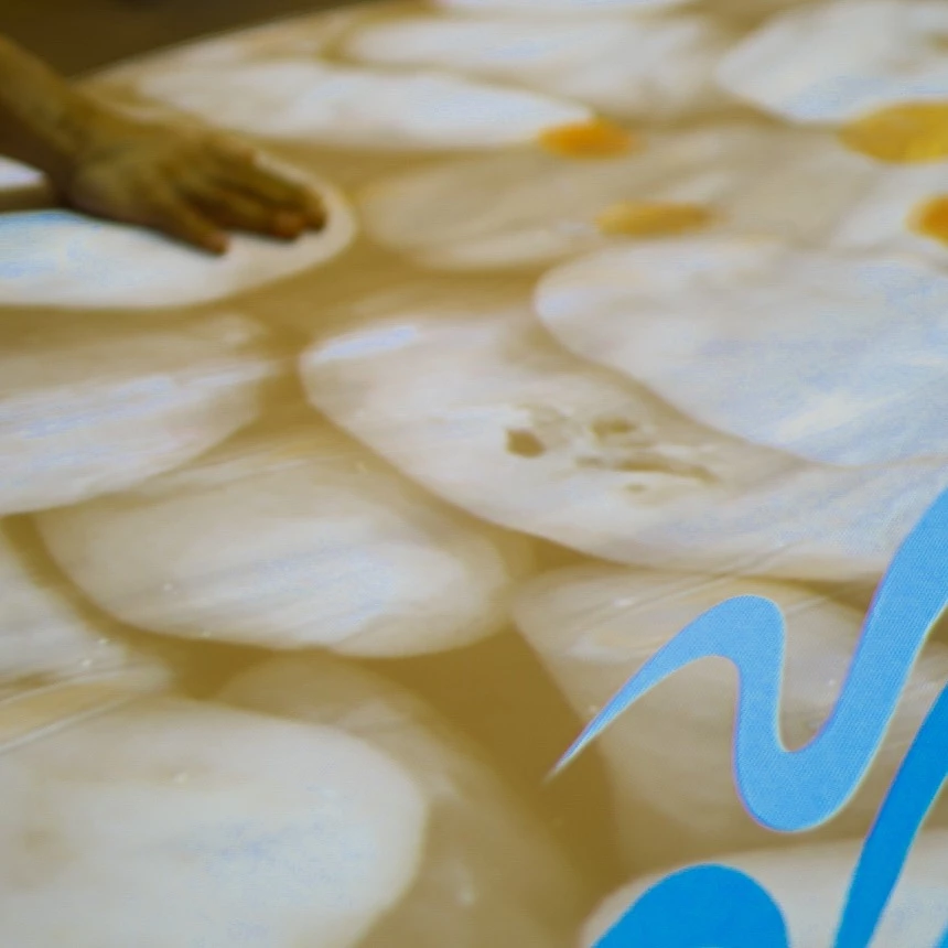 An interactive table projection in the Therme VitaSol: hand touches the projection surface, this creates wave movements and the virtual fish swim away