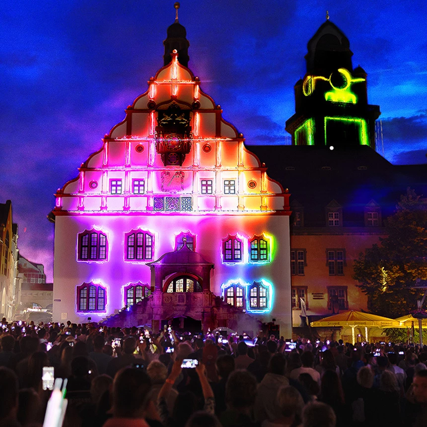 3D video mapping projection for the city anniversary in Plauen stages the town hall with colorful building-specific effects