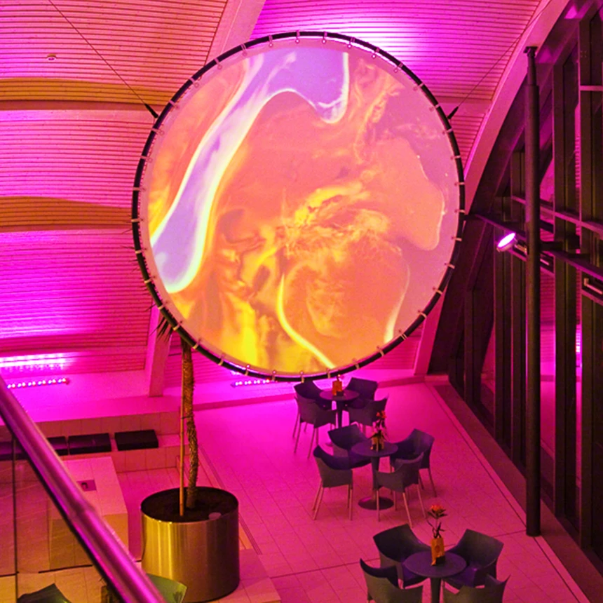 A round canvas shows colourful, changing forms