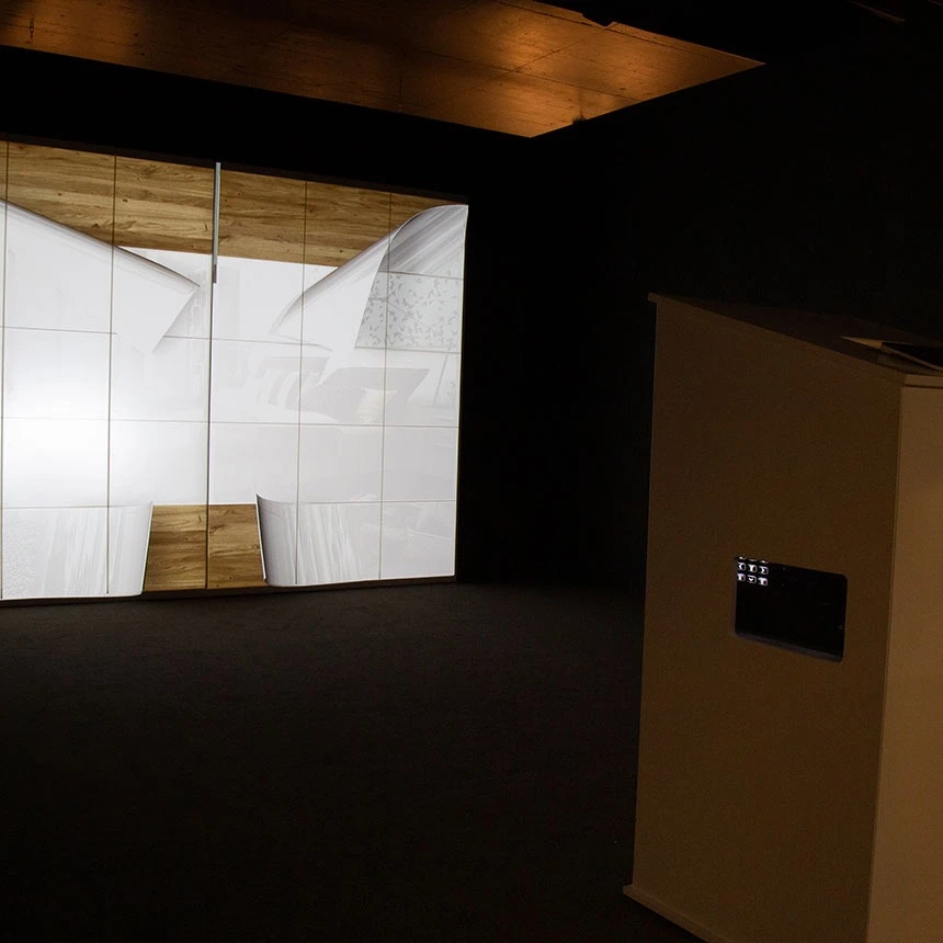 Interactive projection on the cabinet system at the Musterring in-house exhibition: the visitor can use a tablet to configure various surfaces and functionalities of the furniture