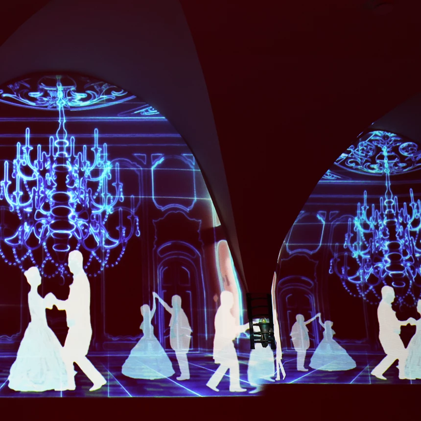 In the vault of Arenfels Castle, a light installation can be seen, showing silhouettes of dancing couples in a festive setting