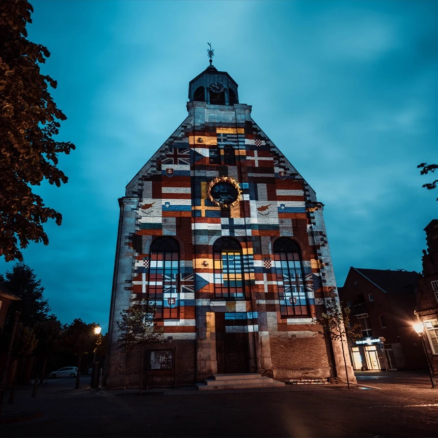3D video mapping of European flags on the facade of the church