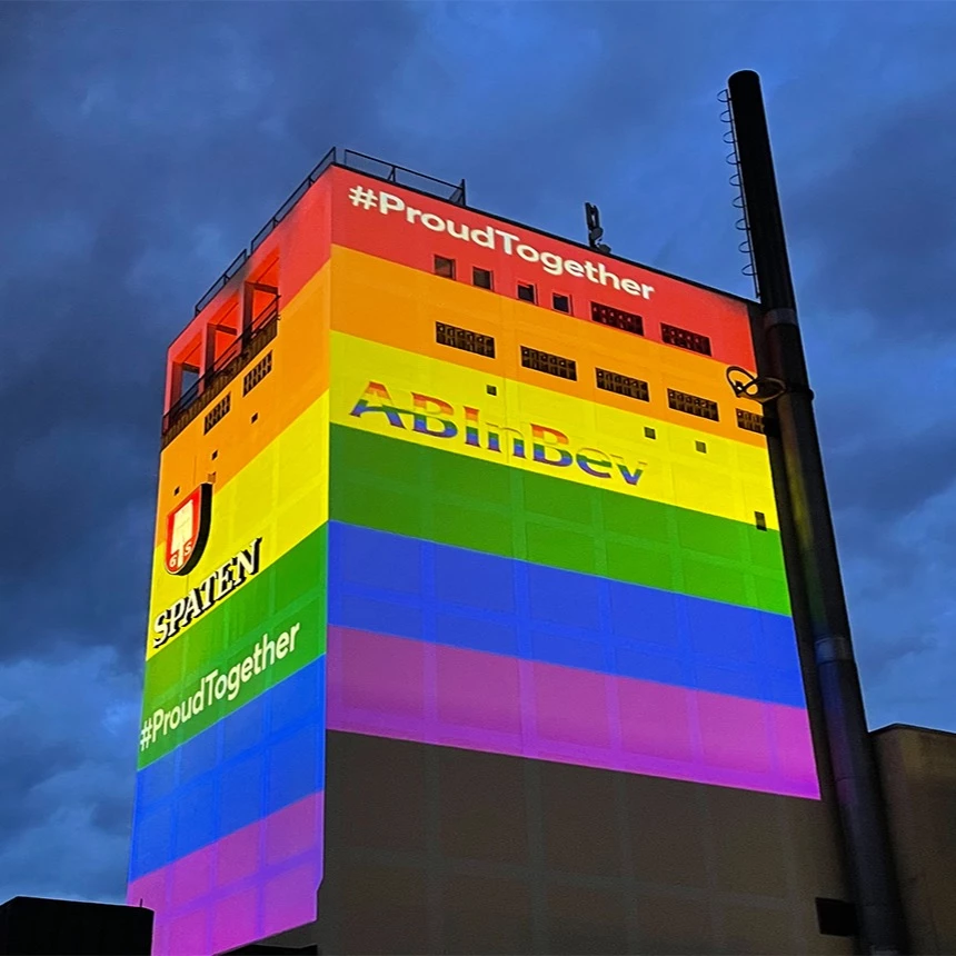 Facade projection of the rainbow colors on 2 sides of a brewery tower