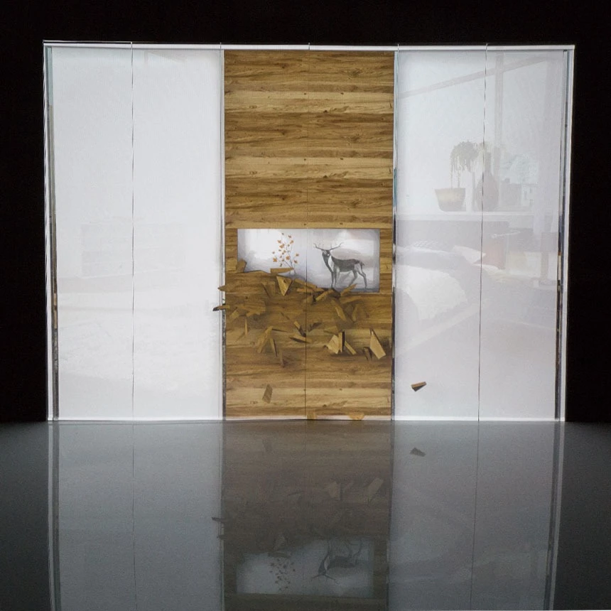Video installation on piece of furniture for exhibition: 3D effects transform the appearance of the cabinet and create a storage compartment with a decorative deer