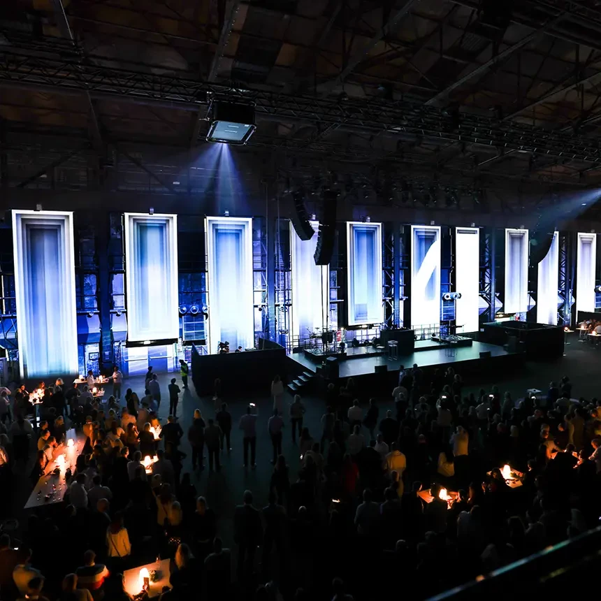 During an anniversary event, various projection surfaces in the Jahrhunderthalle in Duisburg are illuminated site-specifically
