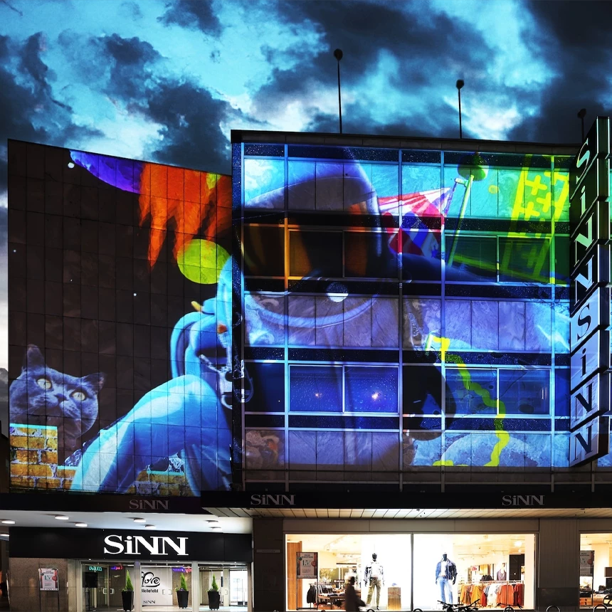 Building projection on a department store in Bielefeld showing an astronaut underwater
